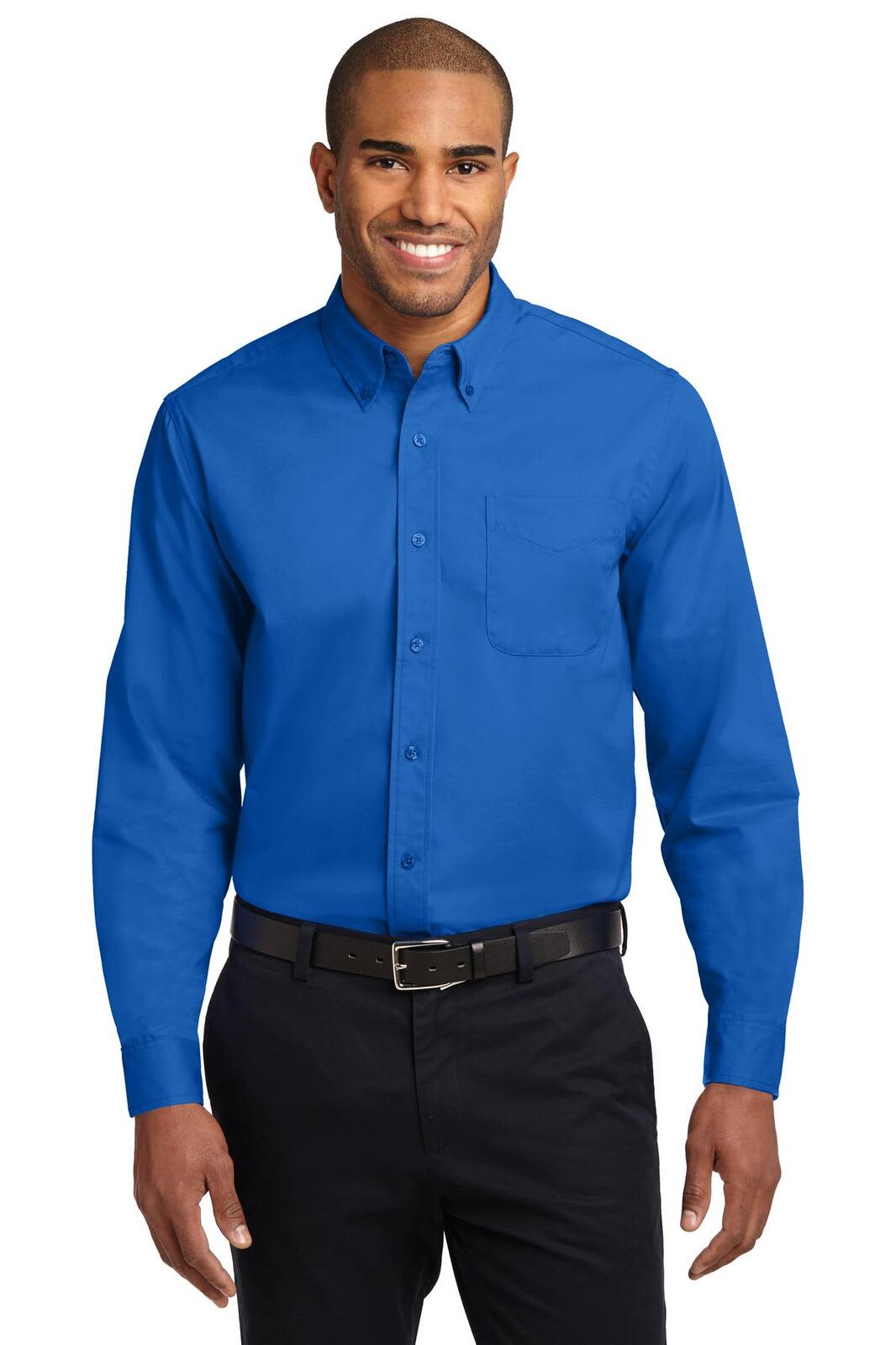 A man wearing a bright blue long sleeve button-up shirt with a chest pocket and a black belt.
