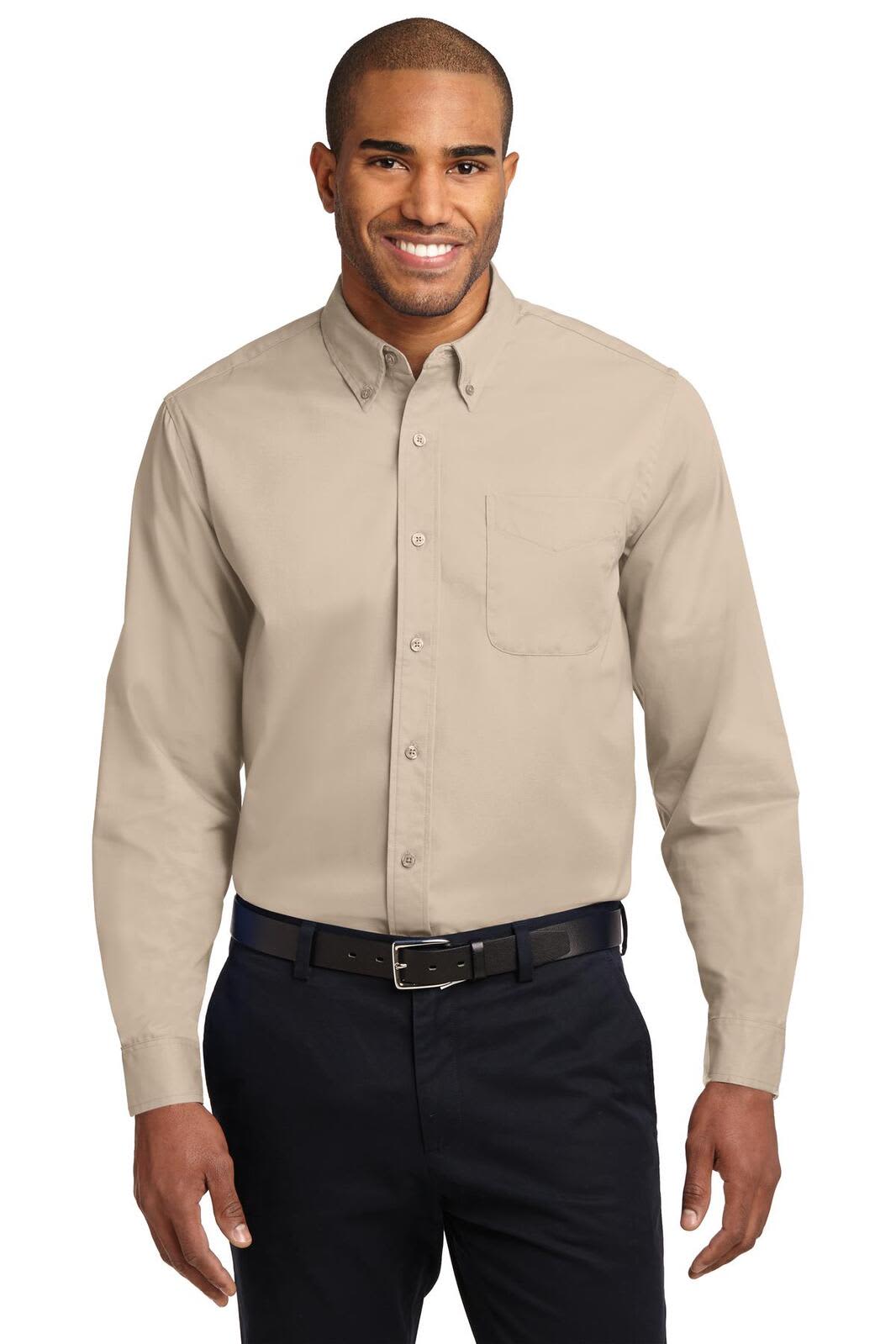 A long sleeve button-up shirt in beige, featuring a chest pocket and worn with dark trousers.