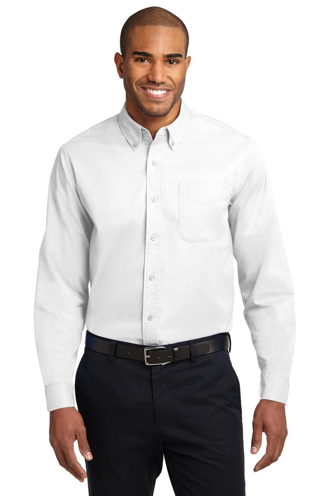 A long sleeve white button-up shirt with a pocket, worn by a smiling man in dark trousers and a belt.