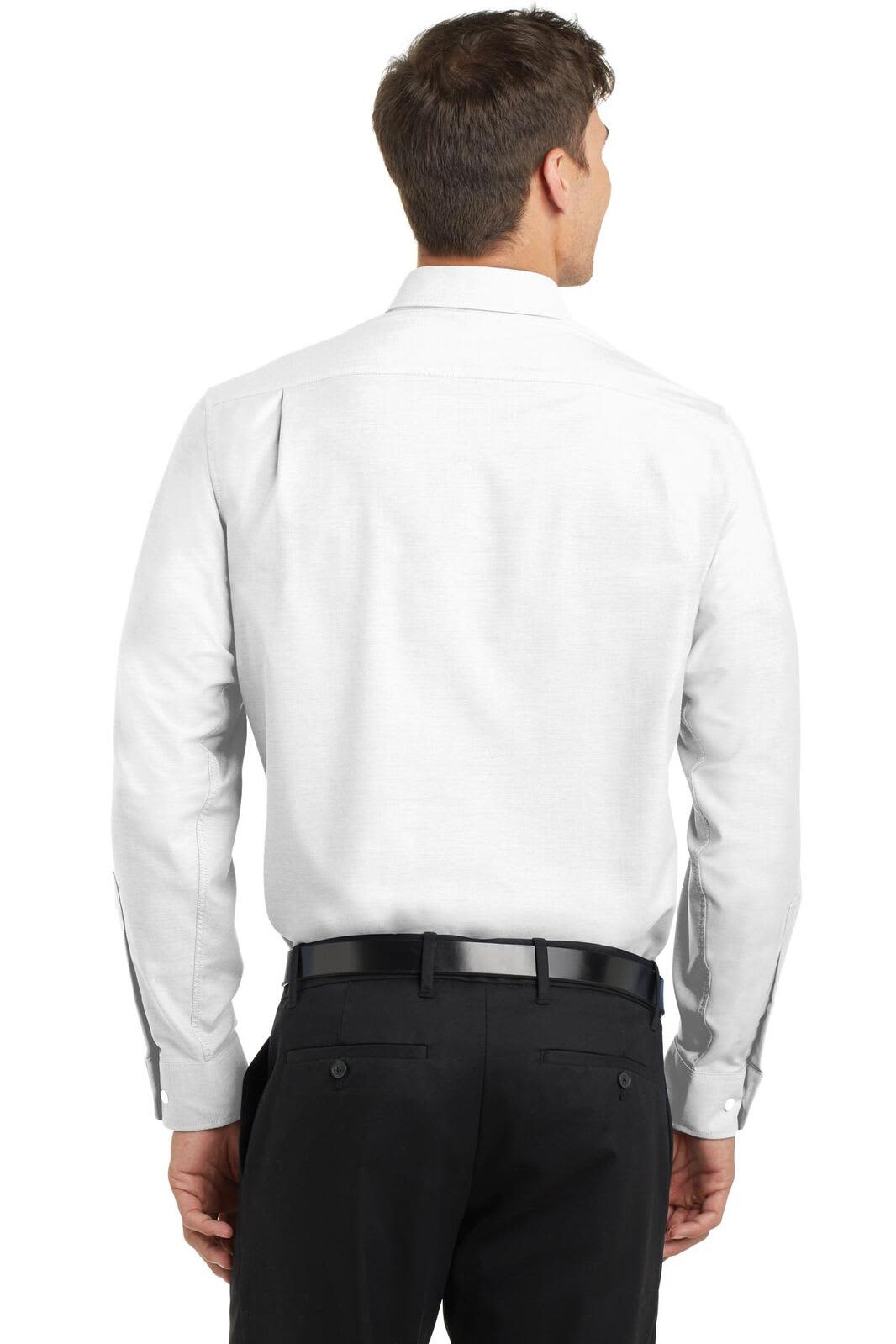 A back view of a white button-up shirt worn by a man, featuring a logo on the collar and black trousers.