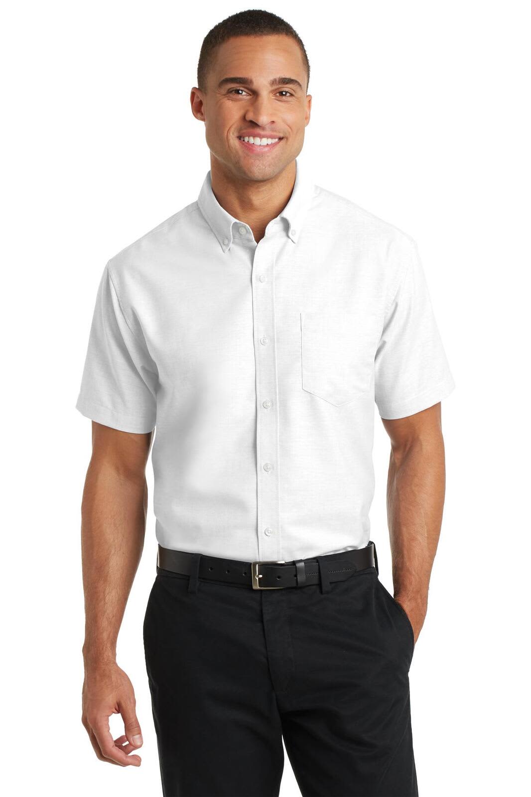 A short-sleeve white button-up shirt with a chest pocket, featuring a logo and paired with black trousers.