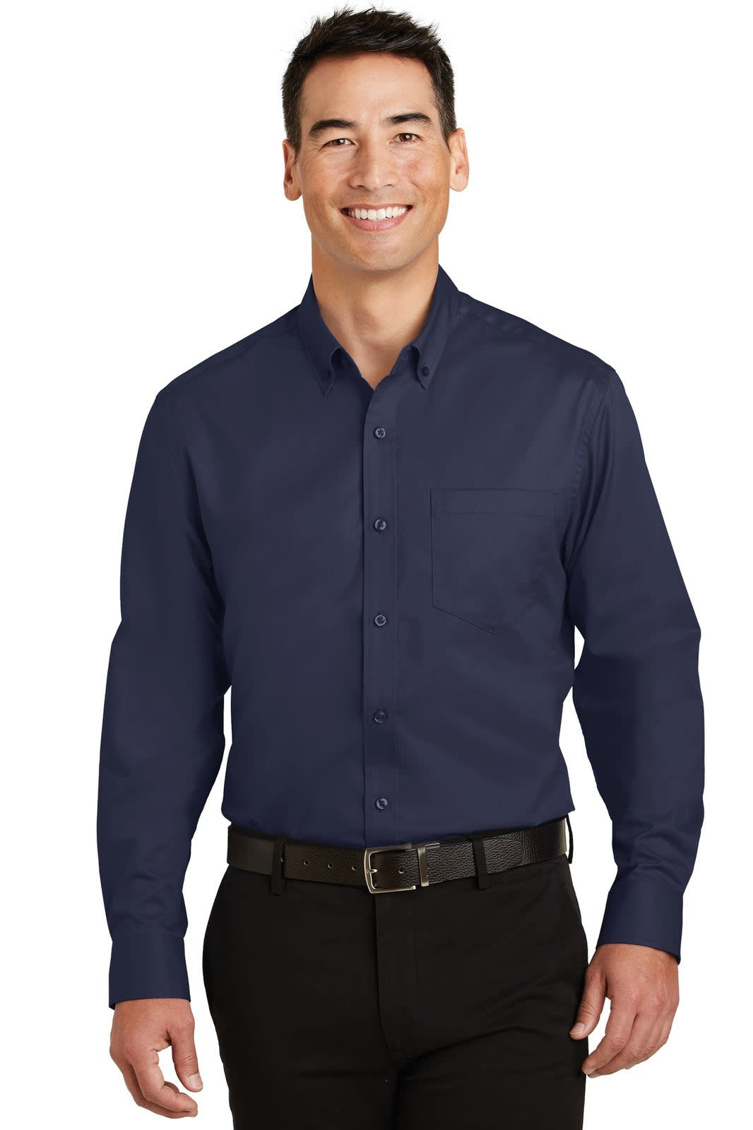 A man is wearing a navy blue button-up shirt, featuring long sleeves and a pocket, with a belt and dark trousers.