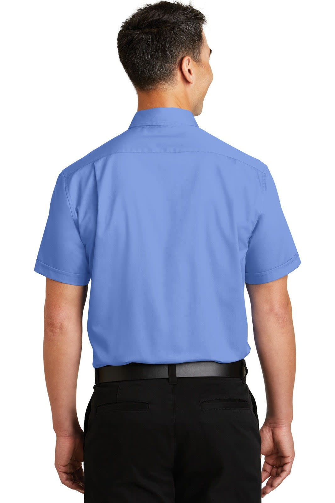 A man wearing a short sleeve, light blue button-up shirt, viewed from the back. Features a logo.