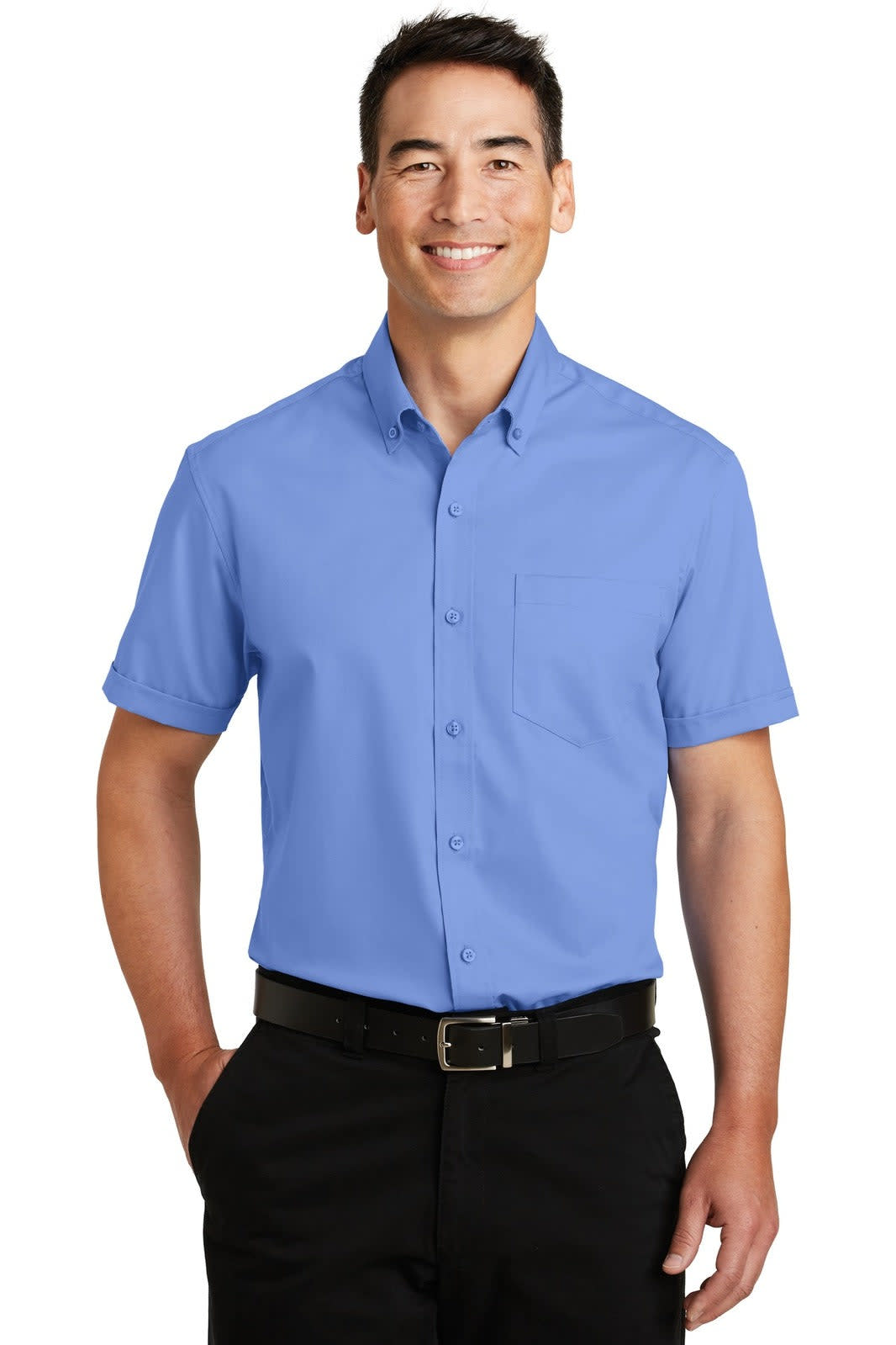 A man wearing a short-sleeve button-up shirt in blue with a pocket. The shirt has a logo on it.