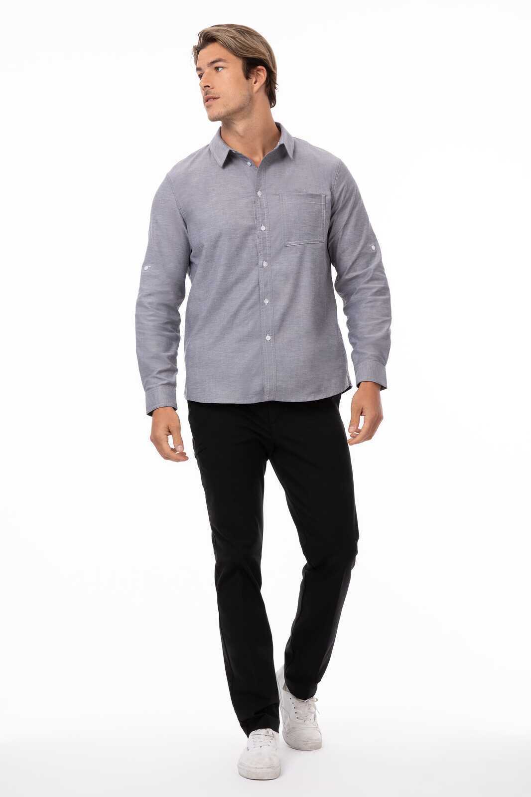 A classic blue button-up shirt for men, featuring a collar and long sleeves, paired with black trousers.