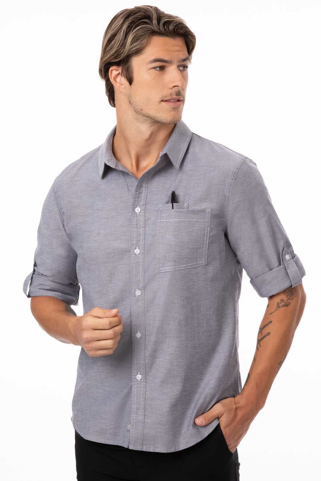 A classic blue button-up shirt for men featuring roll-up sleeves and a chest pocket with a pen holder.