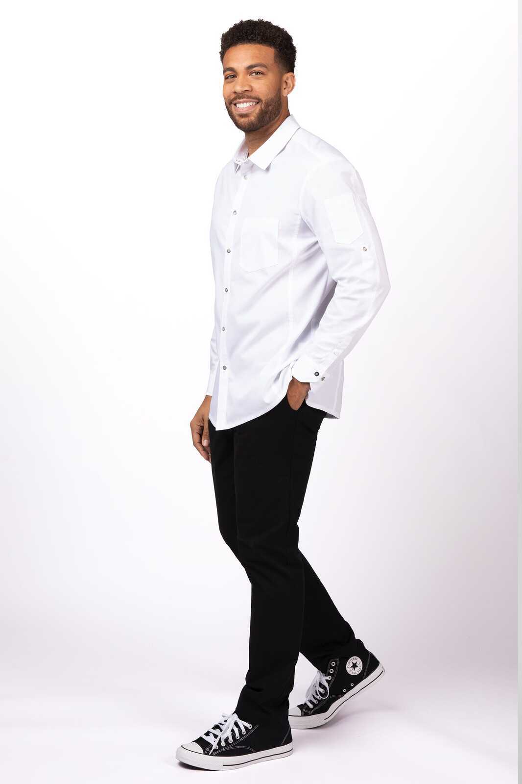A men's black shirt with a classic collar and buttons, worn with black trousers and sneakers.