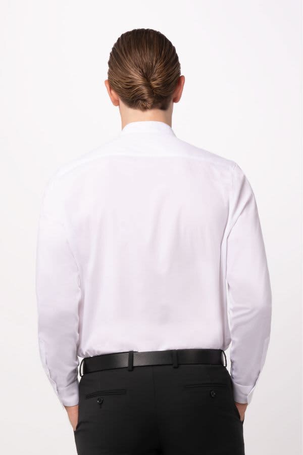 A man wearing a white button-up shirt, viewed from the back, with black pants and a sleek hairstyle.
