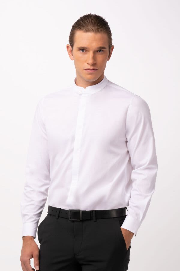 A white button-up shirt with a high collar, styled with a black belt and black trousers. The shirt has a branding logo.