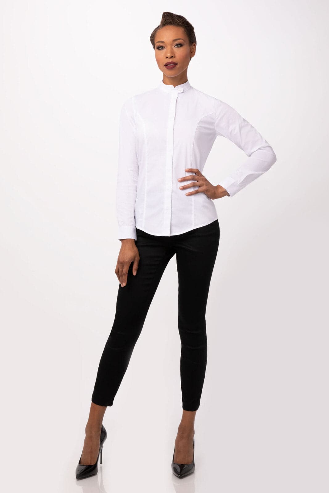 A women's white button-up shirt with long sleeves, paired with black fitted pants and high heels.