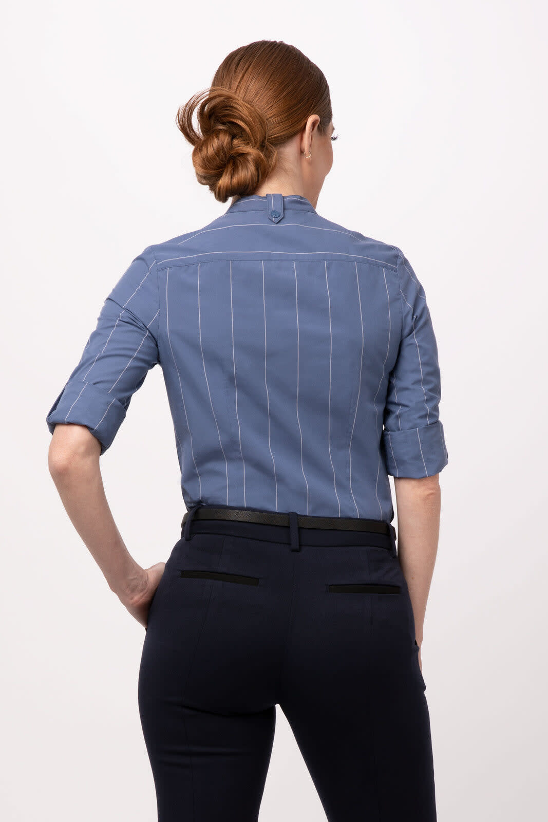 A women's blue shirt with vertical stripes, featuring rolled sleeves and a collar, shown from the back.