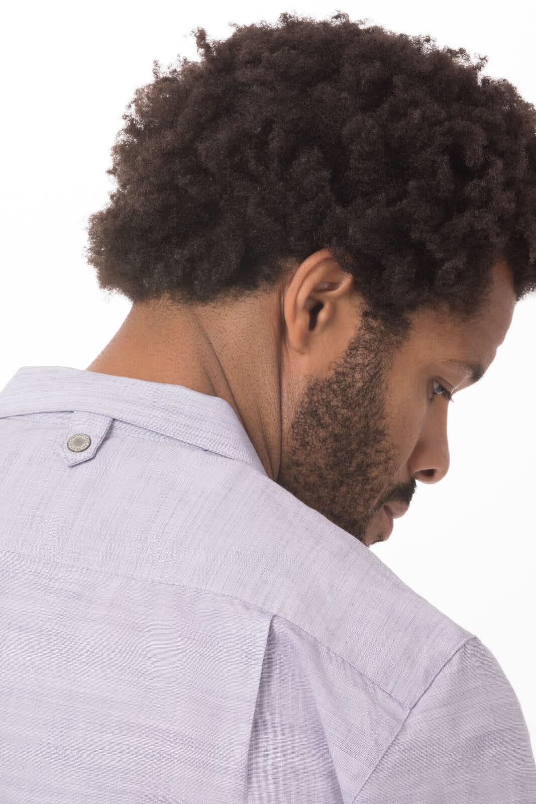 A light grey men's shirt with a back button detail, featuring a casual design and a branding logo.