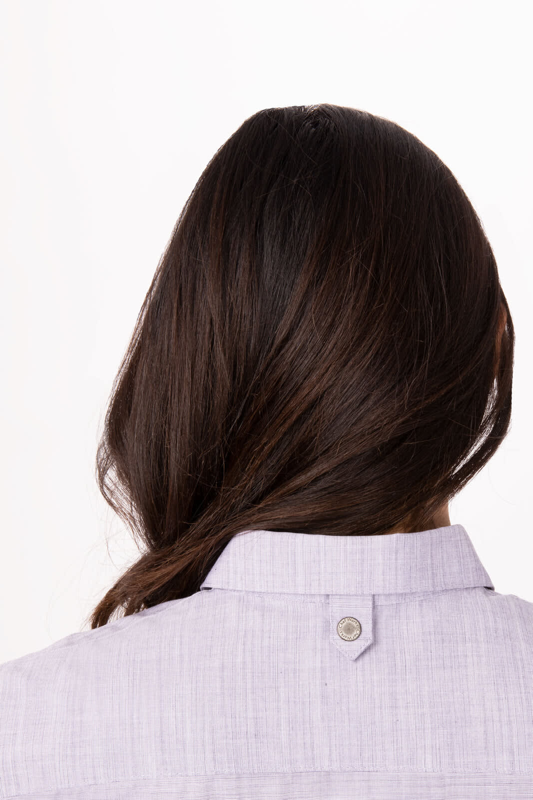 A lavender women's button-up shirt featuring a collar and a small branding logo at the back.