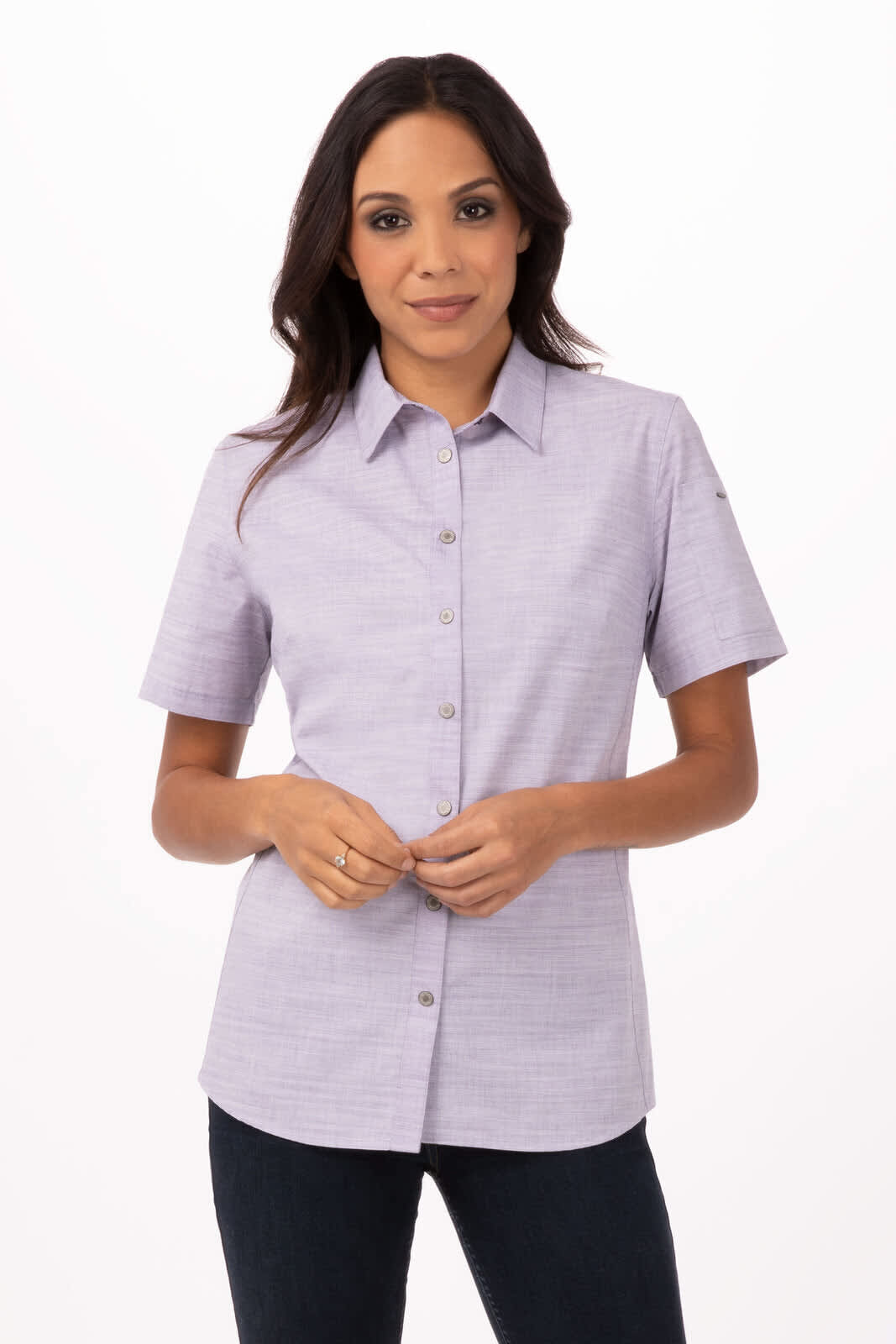 A button-up women's shirt in light purple with short sleeves, featuring a collar and a logo.