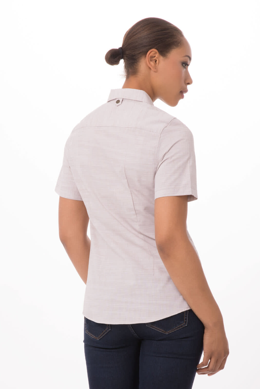A women's short-sleeve button-up shirt in a light hue, featuring a subtle pattern and a back button detail.