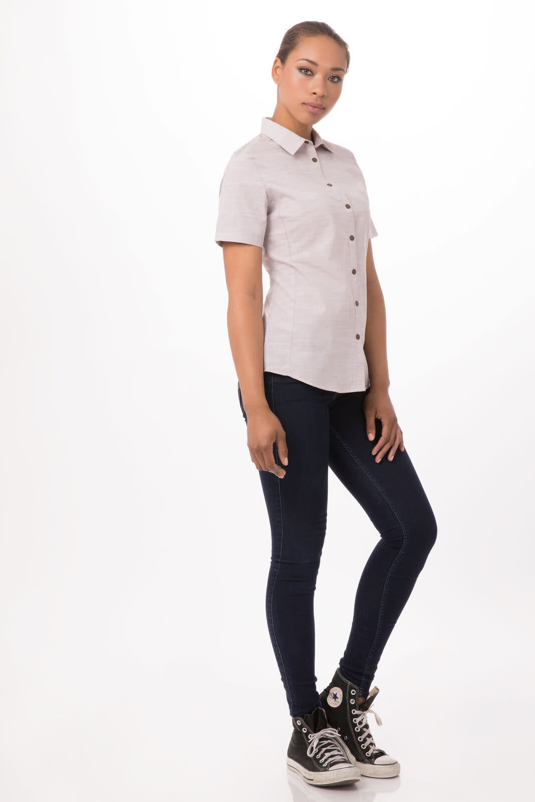 A light grey button-up shirt on a model, paired with dark blue jeans and black high-top sneakers.