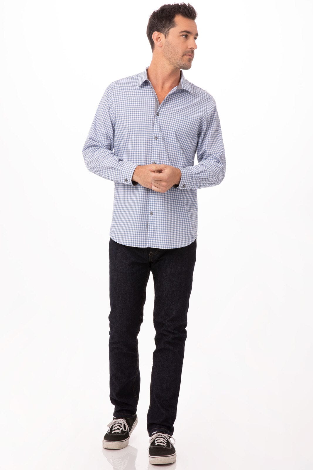 A modern gingham men's long sleeve dress shirt in blue and white, paired with dark jeans and sneakers.