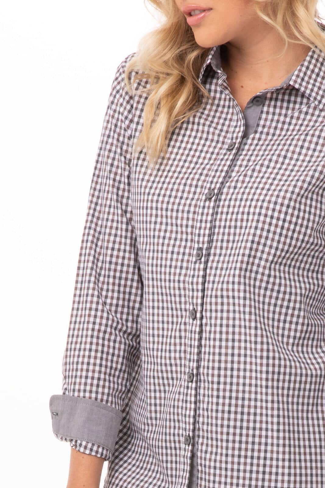 A long sleeve women's dress shirt in a modern gingham pattern, featuring shades of grey and white with button details.