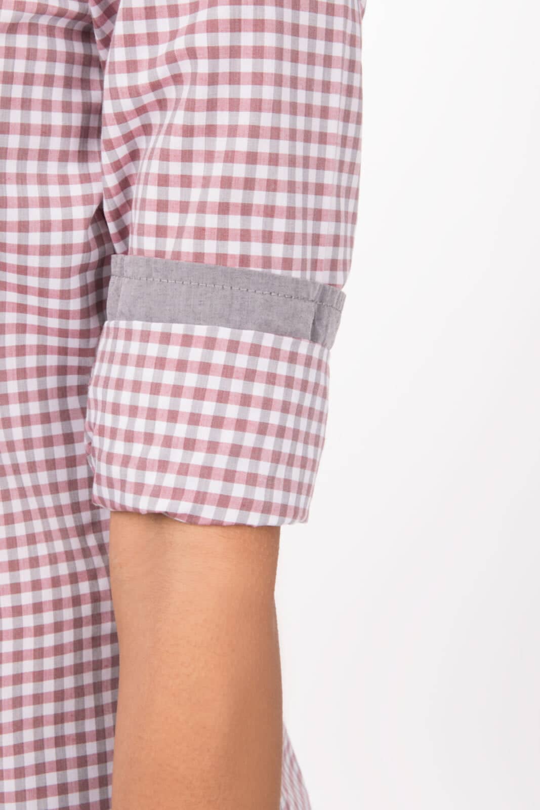 A women's long sleeve dress shirt in a pink and white gingham pattern, featuring rolled cuffs with grey detailing.