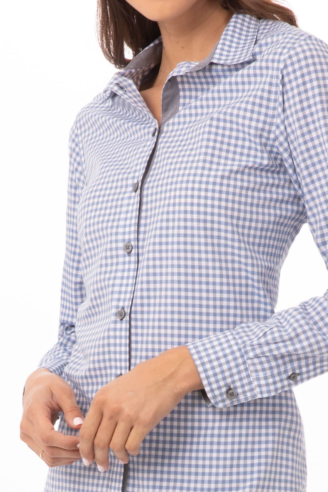 A long sleeve dress shirt in blue and white gingham pattern, featuring a button-up design and a logo.