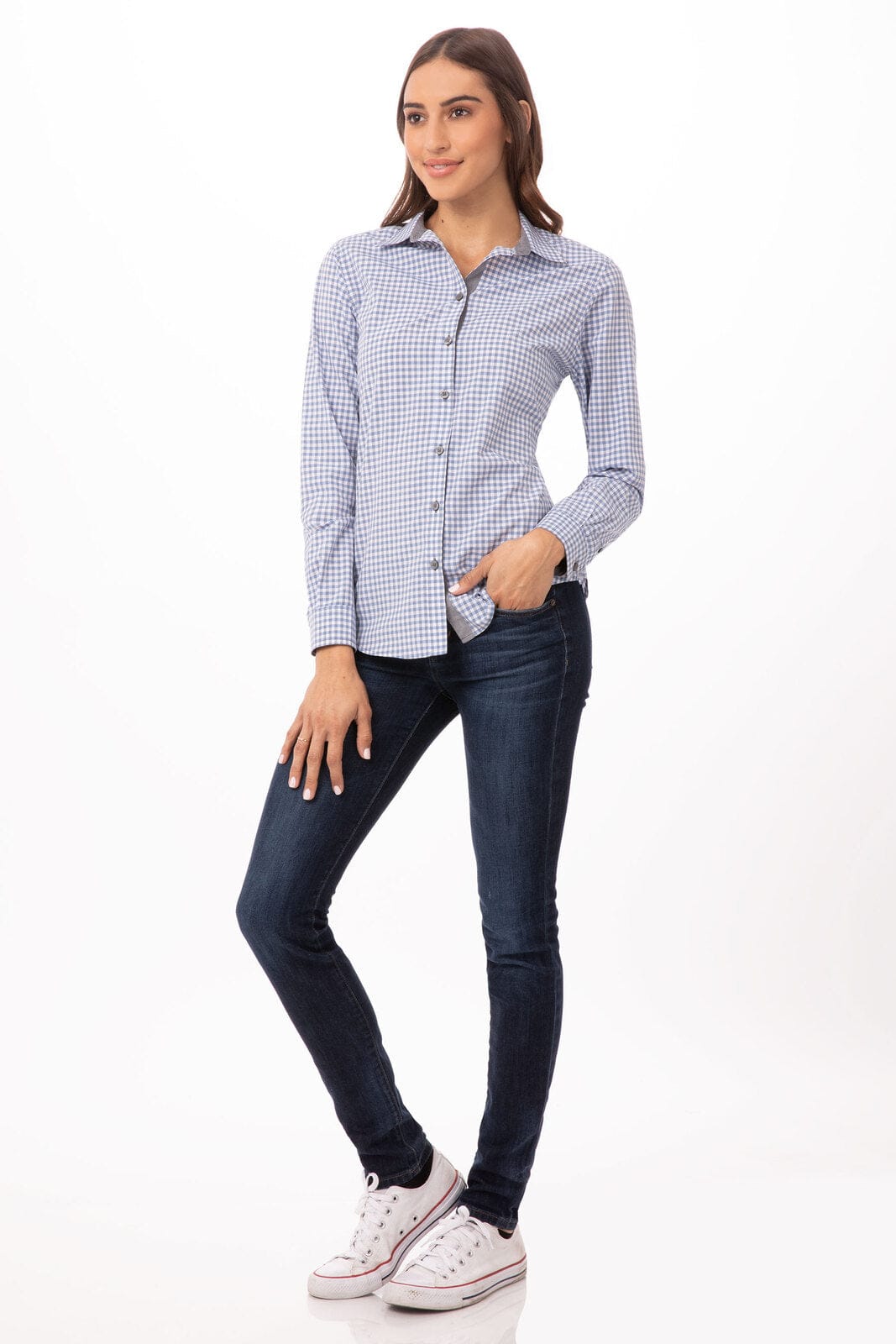 A long sleeve women's button-up dress shirt in blue and white gingham pattern, paired with dark jeans and white sneakers.