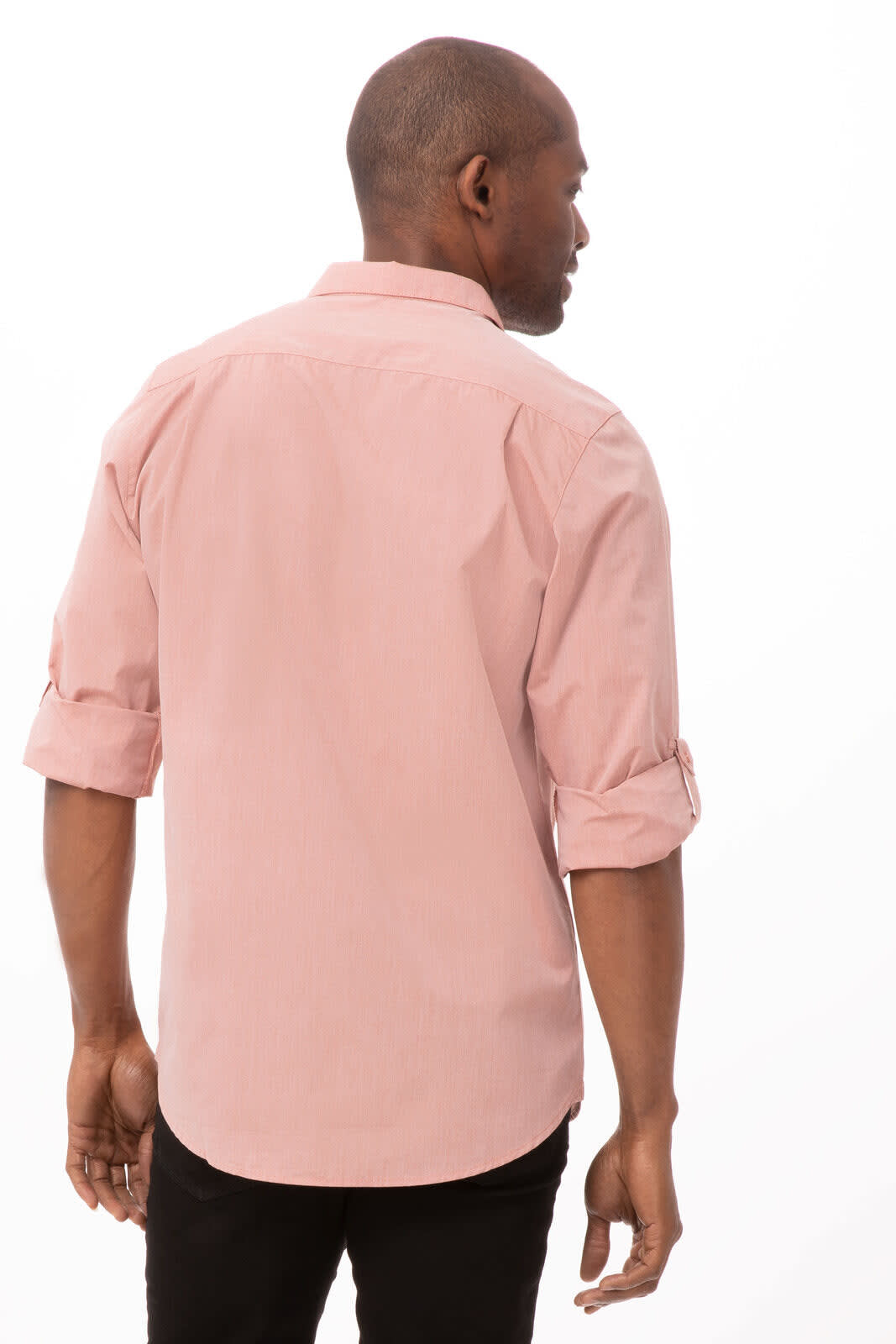 A men's dress shirt in a light pink chambray fabric, featuring long sleeves rolled up and a standard collar.