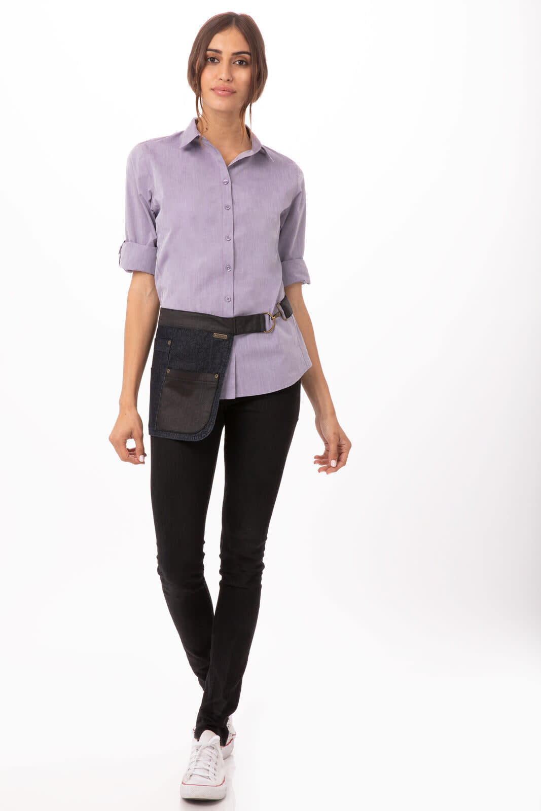 A modern chambray women's dress shirt in light blue, paired with black pants, and a utility belt featuring a pocket.
