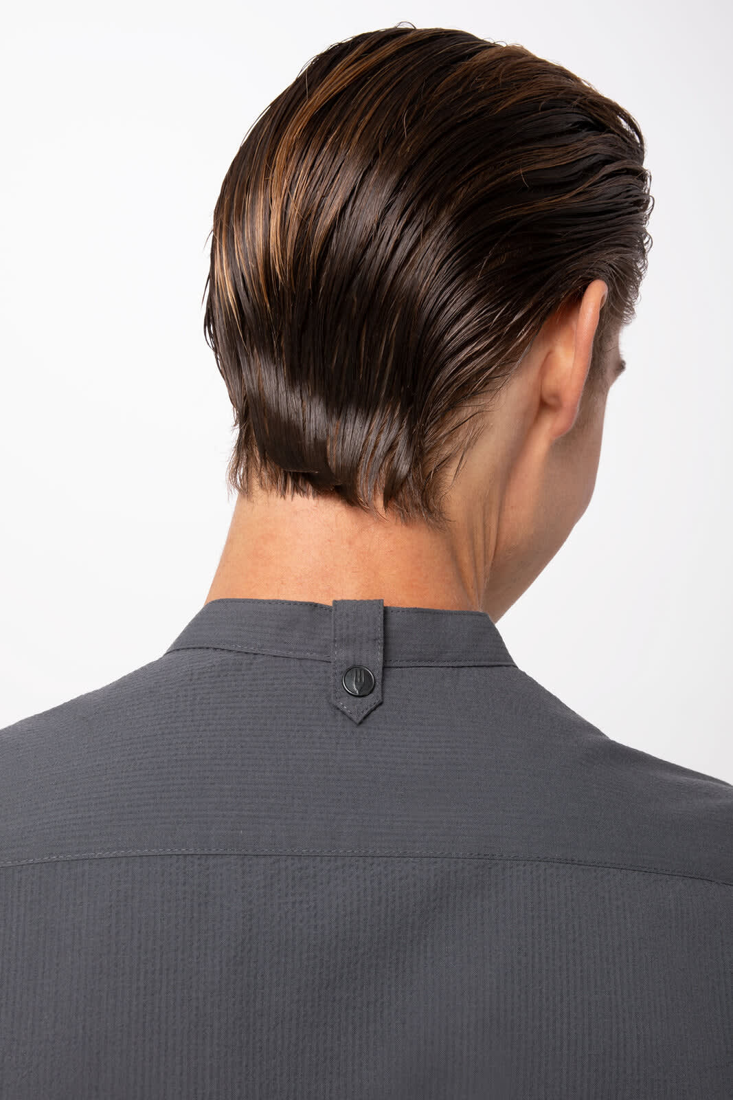 A grey seersucker men's button-up shirt, featuring a back collar detail and a logo.
