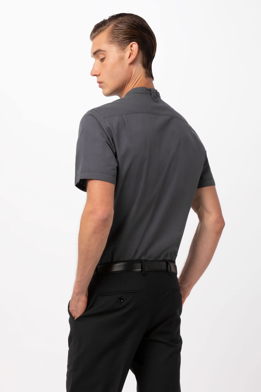 A men's button-up shirt in grey with a short collar, featuring a sleek design and a subtle logo.