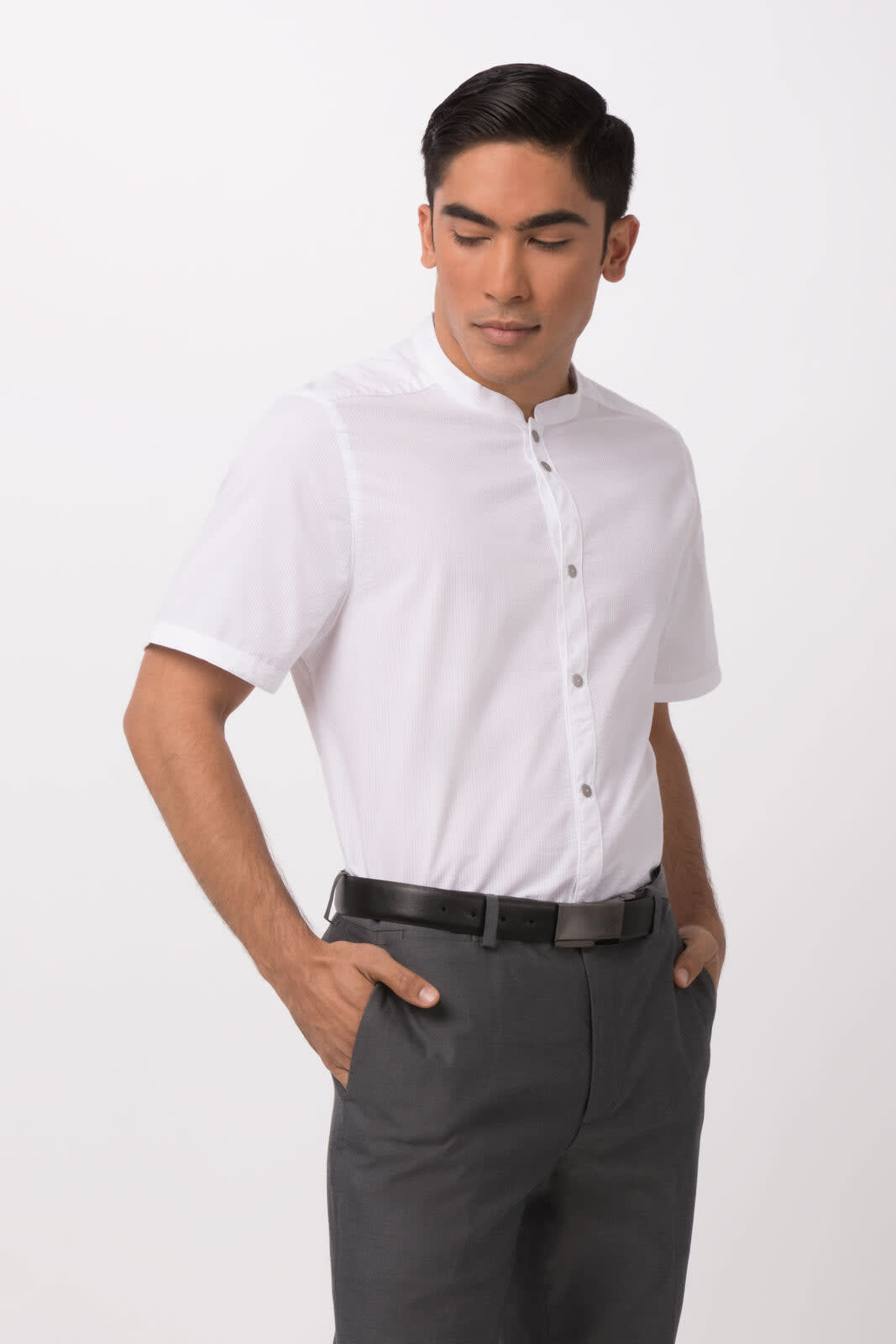 A white seersucker men's button-up shirt displayed on a model, featuring a short collar and short sleeves.