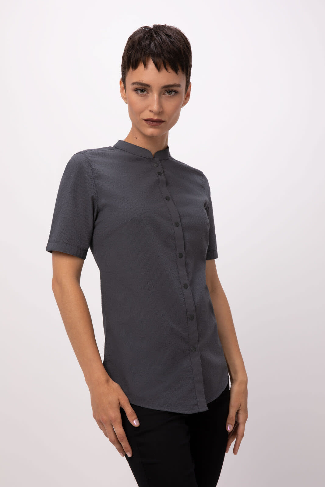 A grey seersucker women's button-up shirt, featuring a collarless design and short sleeves, displayed on a model.