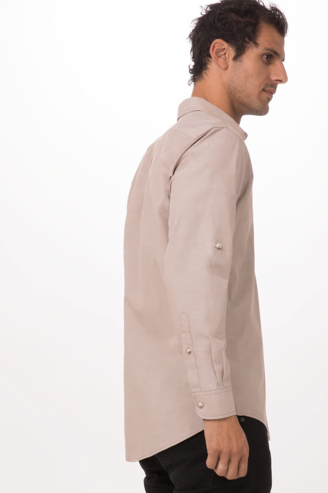 A light grey chambray button-up shirt is displayed on a model, showing the side profile and sleeve details.