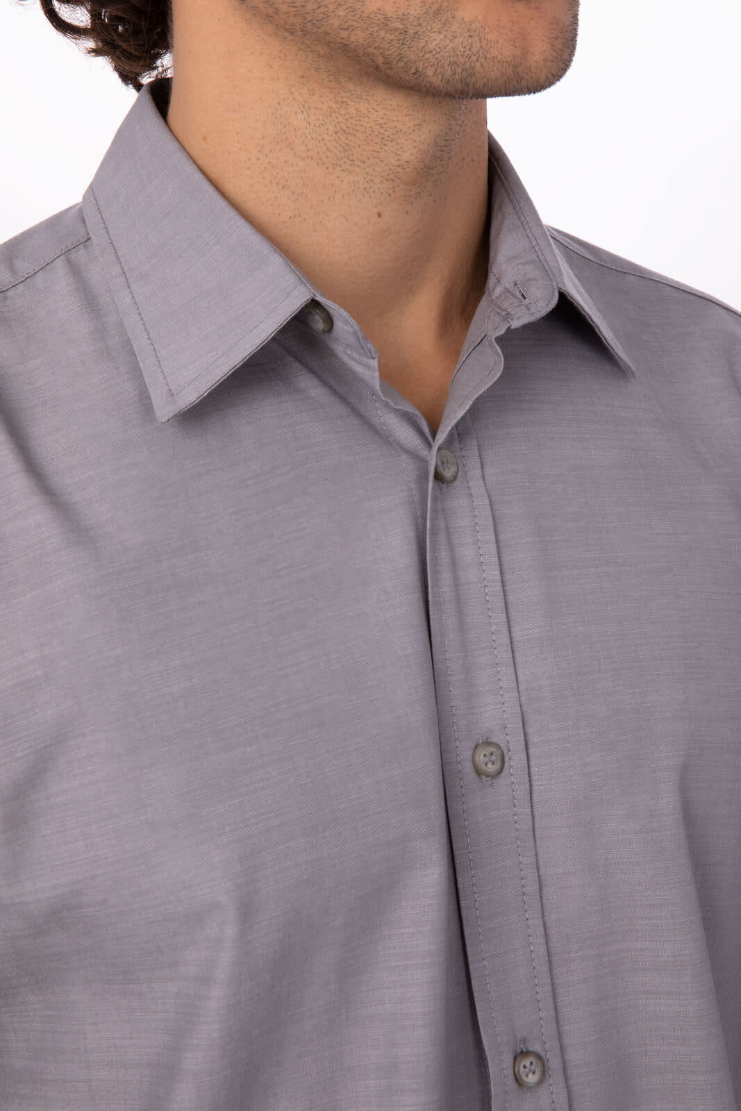 A grey chambray men's button-up shirt featuring a classic collar and button front.