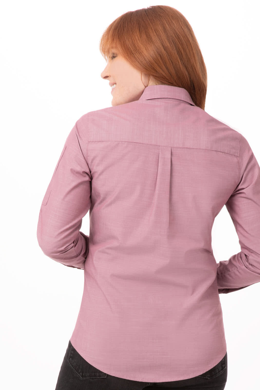 A chambray women's shirt in a soft pink hue, featuring a button-up design and a back yoke detail.