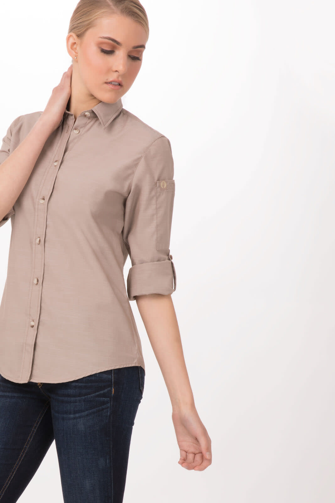 A light beige women's shirt with rolled sleeves and buttons, featuring a logo on the chest.