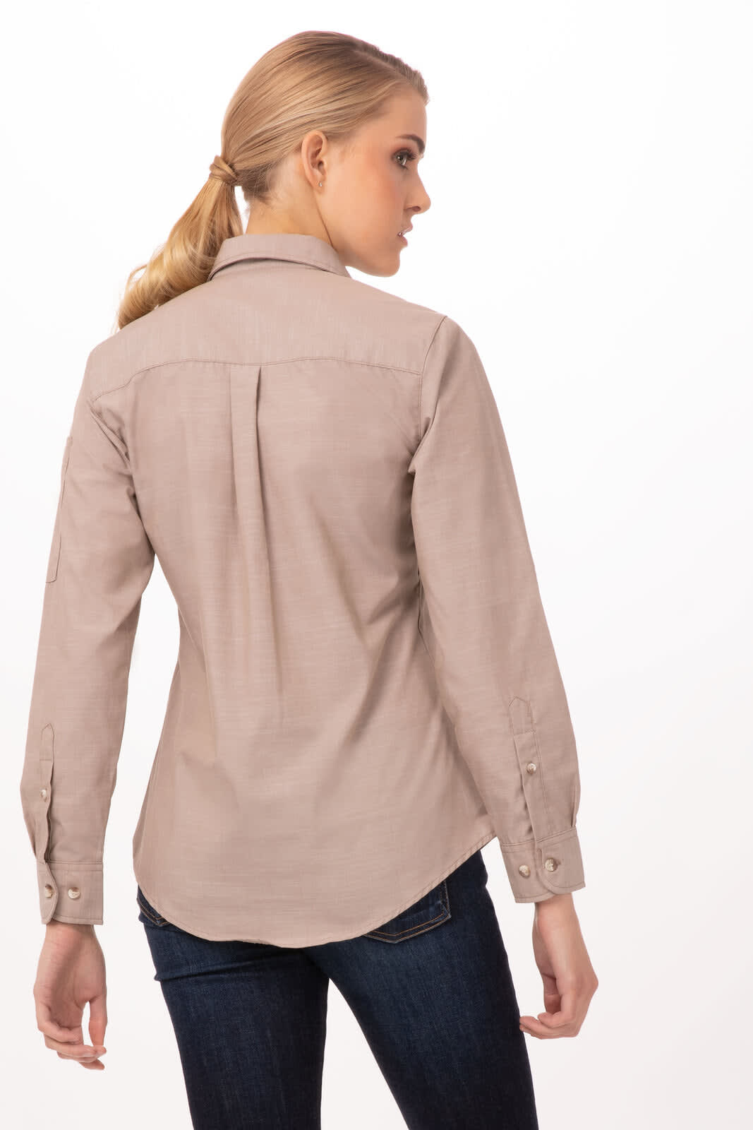 A woman wearing a light brown chambray shirt, viewed from the back, featuring a casual design and buttons.