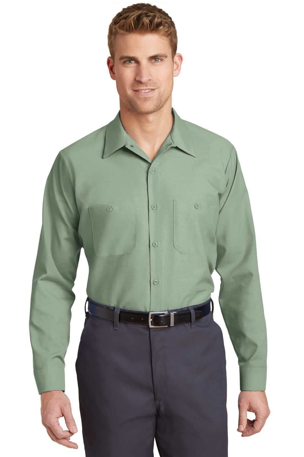 A long sleeve work shirt in sage green, featuring a button-up front and two chest pockets. It has a brand logo.