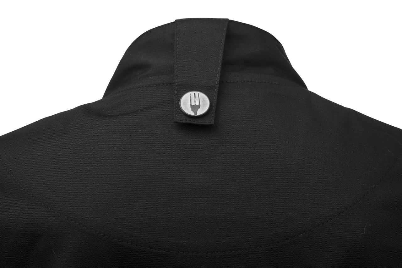 A black chef jacket featuring a press stud closure at the back. It includes a logo detail on the collar.