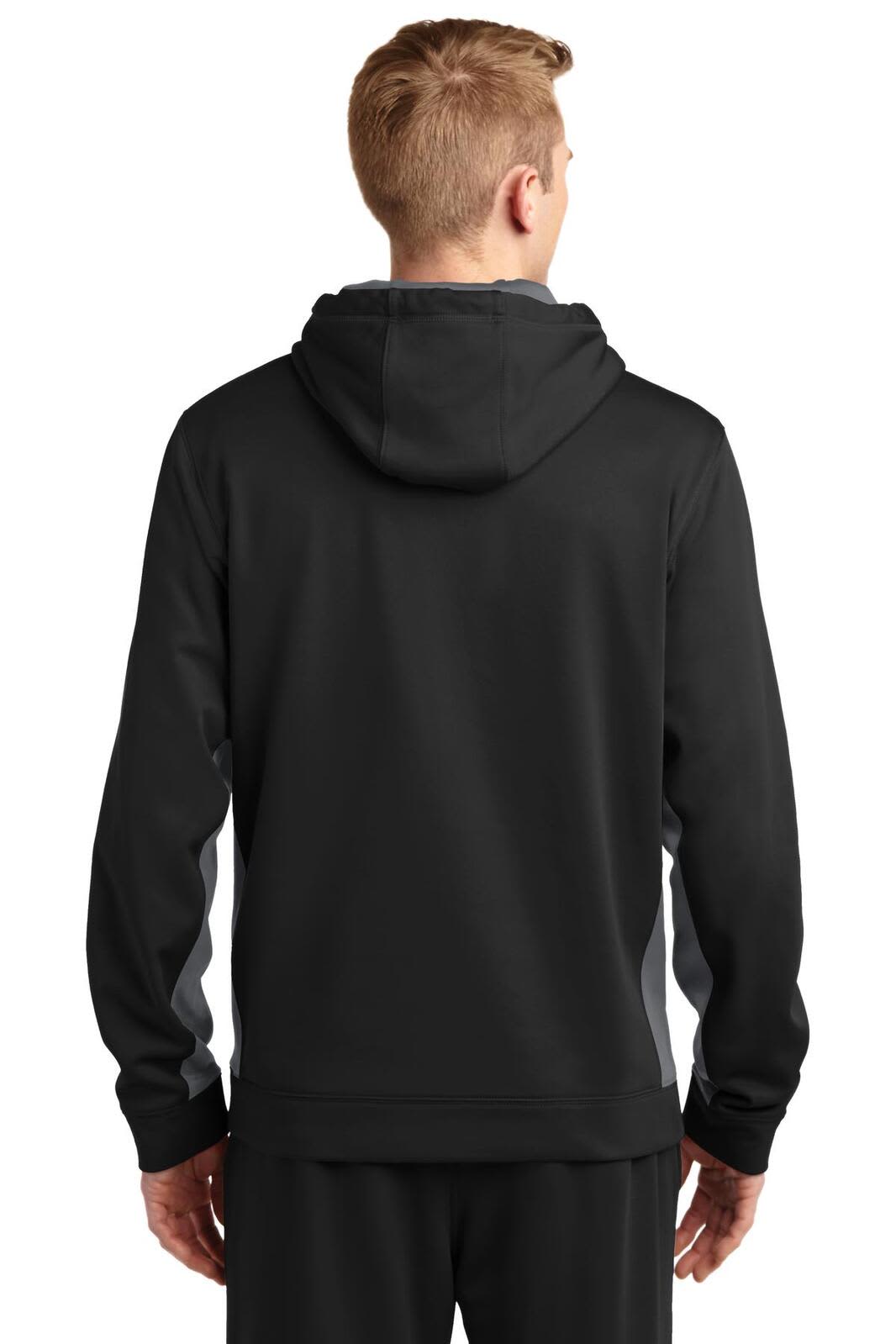 A black and grey hooded pullover featuring a colourblock design and a logo.