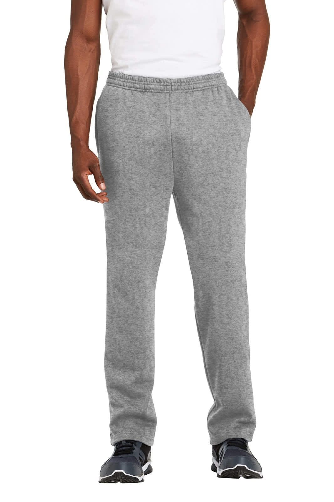 A pair of grey Sport-Tek open bottom sweatpants with pockets, worn by a model standing upright.