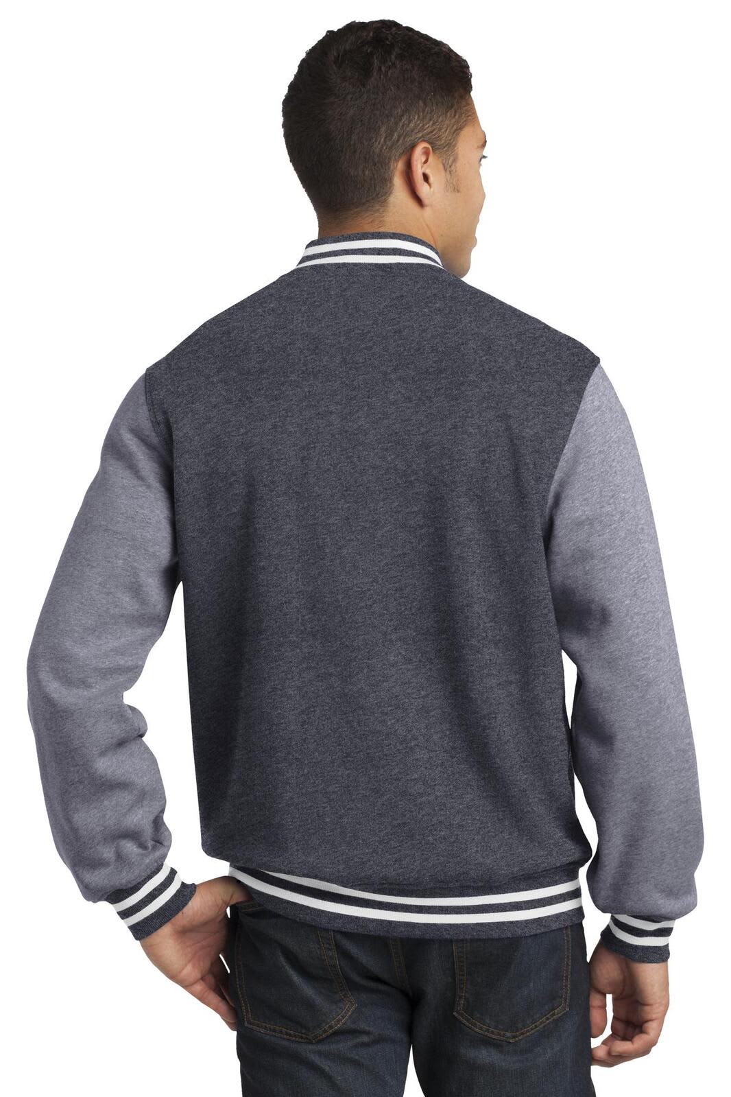 A grey and charcoal fleece letterman jacket featuring striped cuffs and a logo on the sleeve.