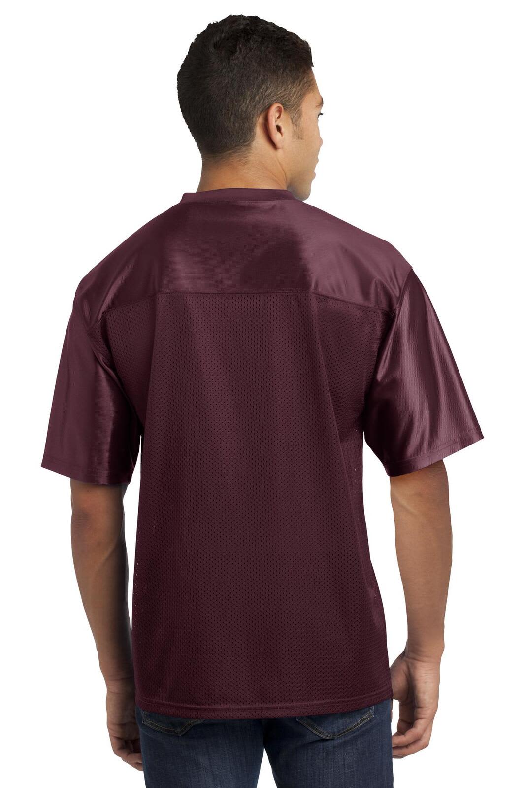 A maroon sports jersey featuring a relaxed fit and a logo on the back.