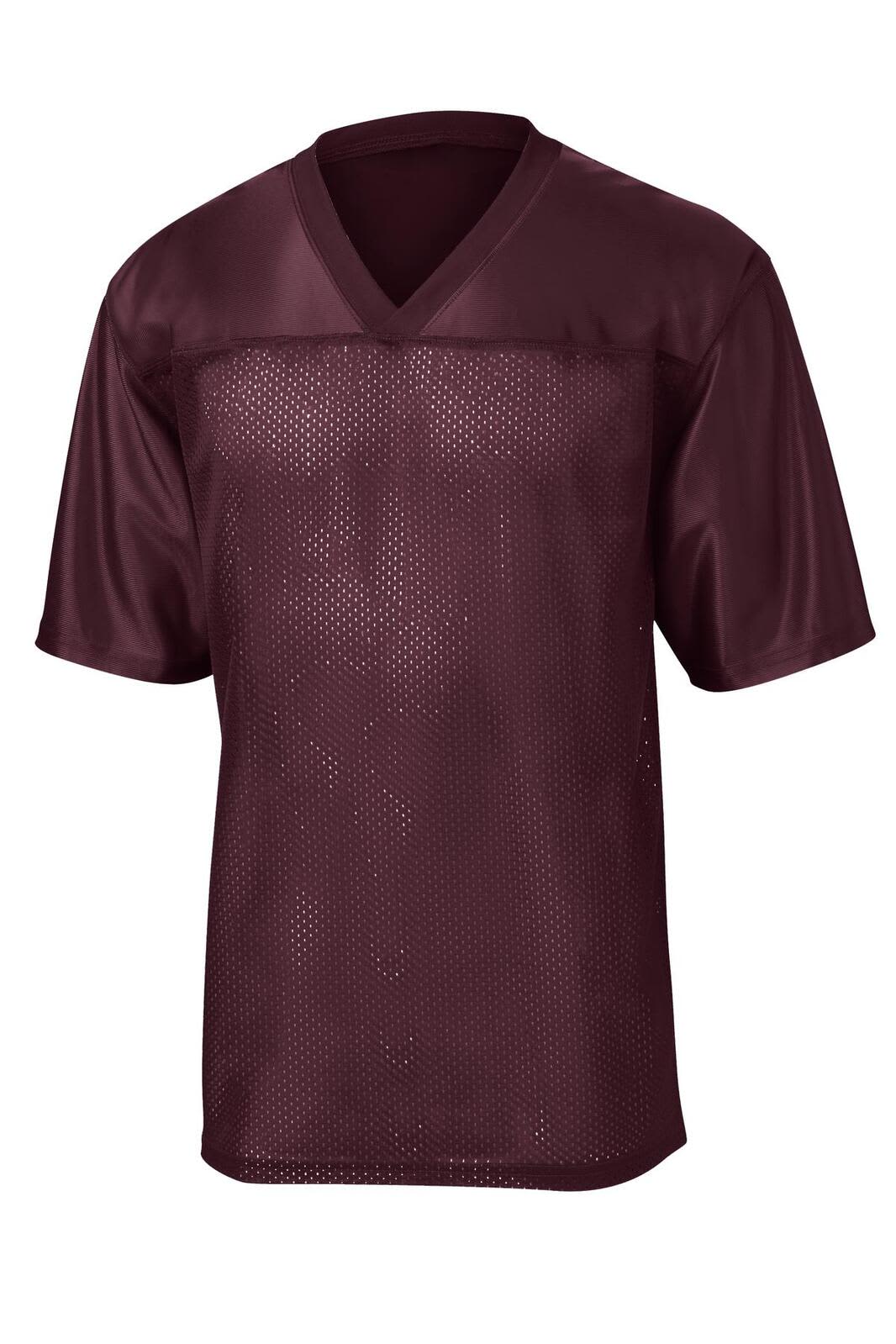 A maroon sports jersey with a V-neck and short sleeves, featuring a mesh design and a logo.