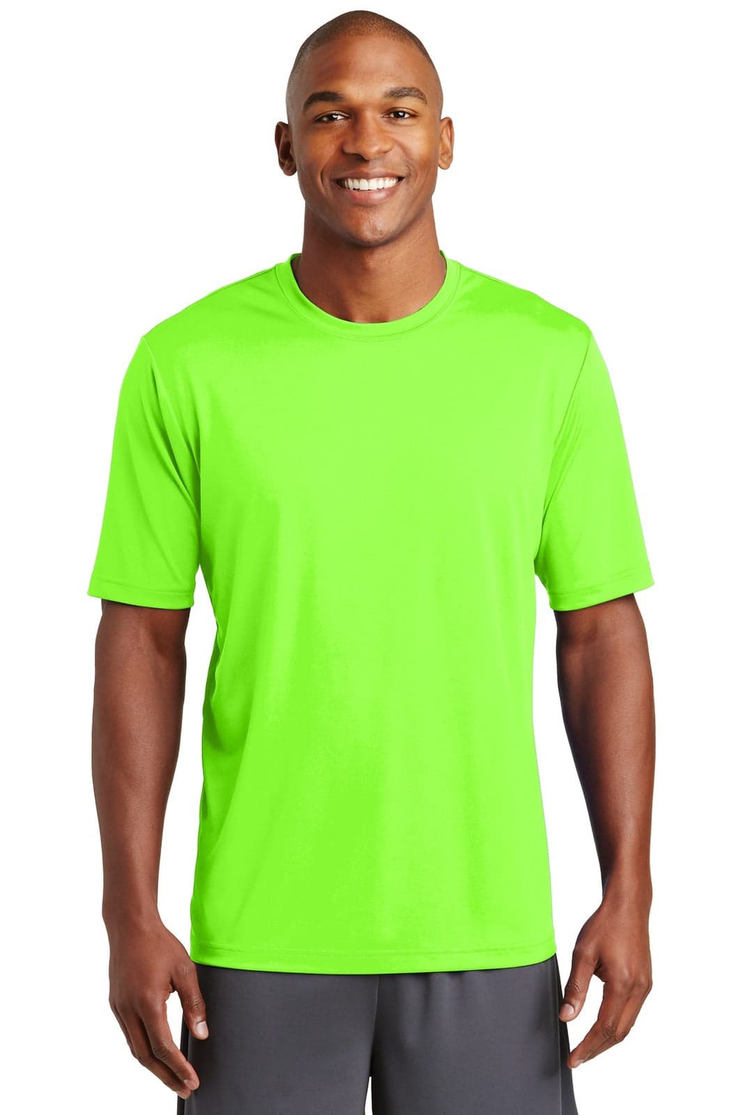 A bright green t-shirt worn by a smiling man, featuring a logo on the front.