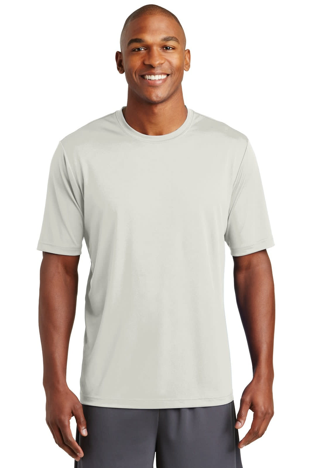 A light grey performance t-shirt on a male model, featuring a crew neck and short sleeves. The shirt has a logo.
