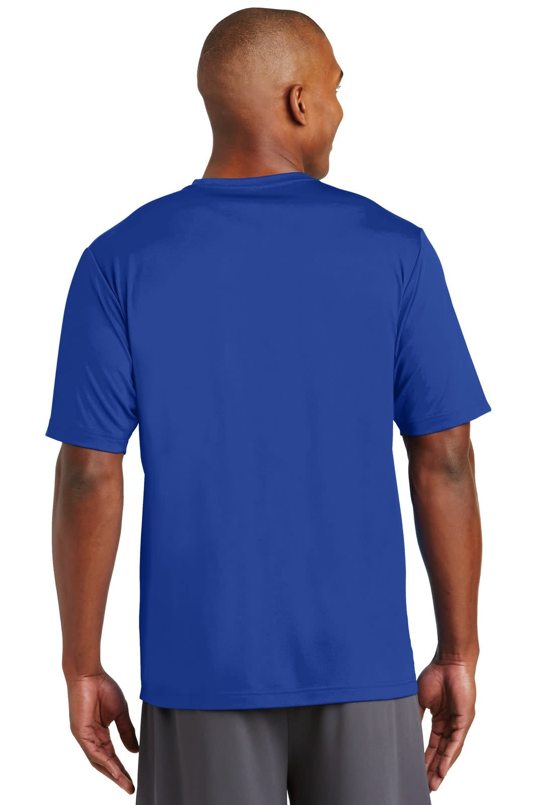 A man wearing a blue Sport-Tek PosiCharge Tough Tee, viewed from the back. The shirt has a logo visible.