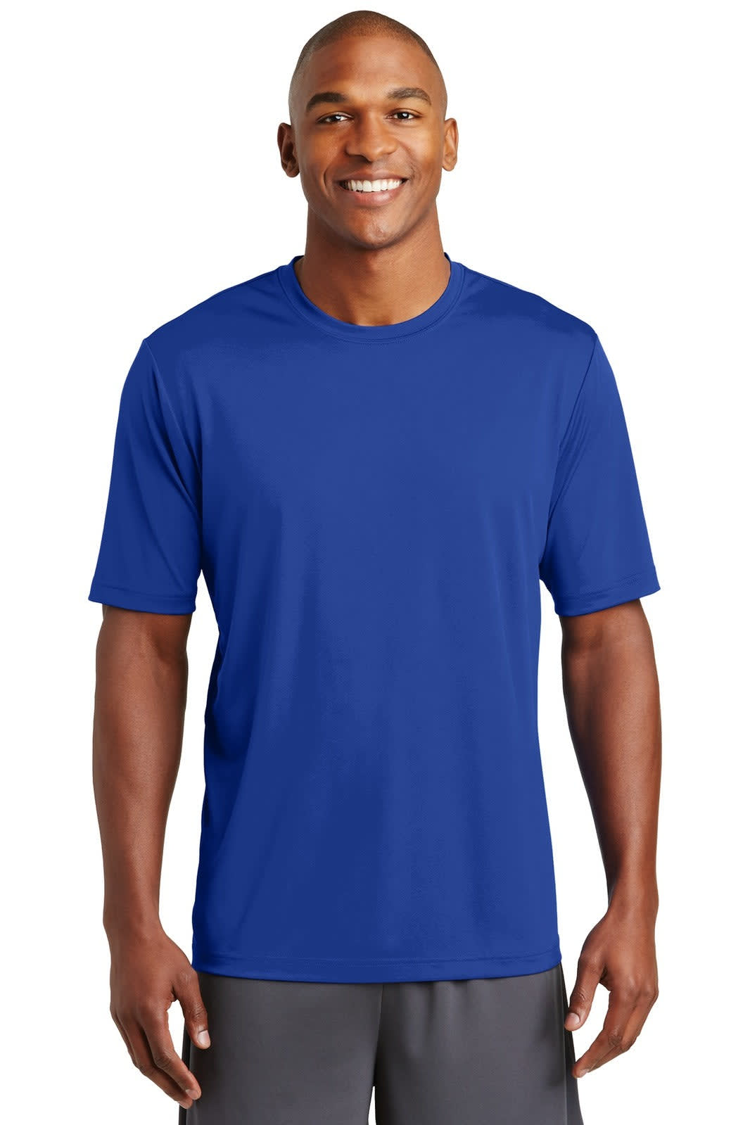 A man wearing a blue short-sleeved t-shirt, featuring a logo, against a plain background.
