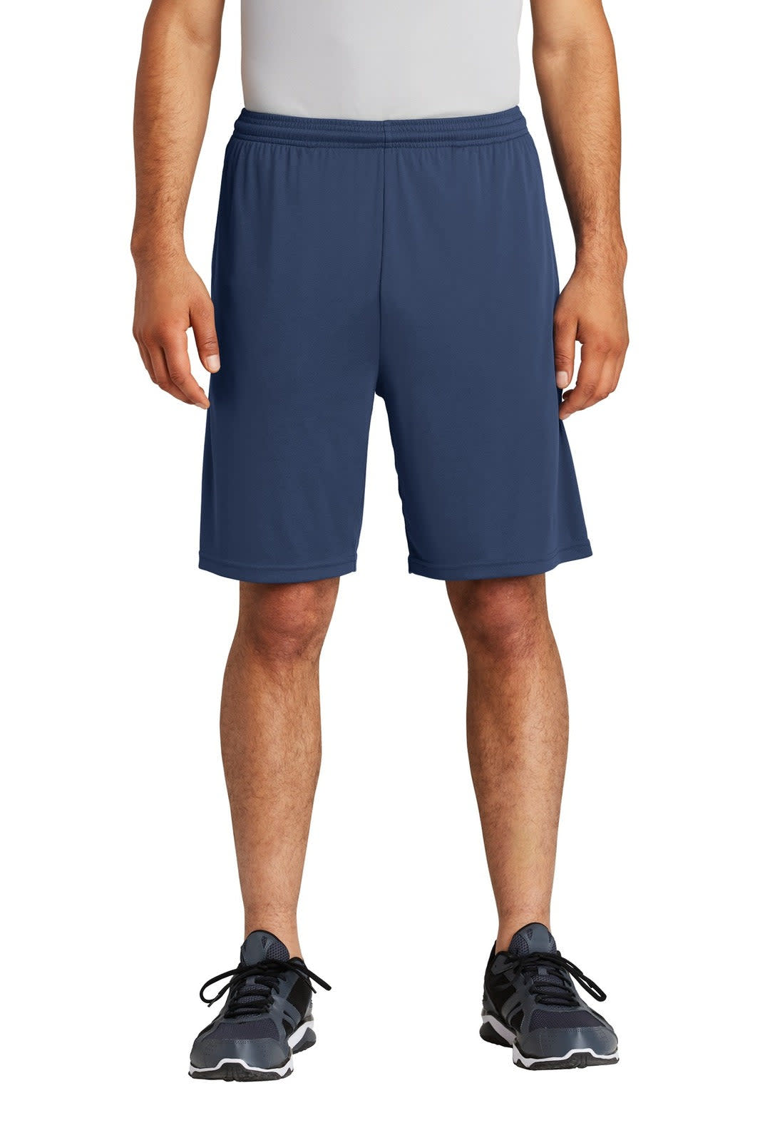 A pair of navy sports shorts, featuring a pocket and an elastic waistband. The model stands in athletic shoes.