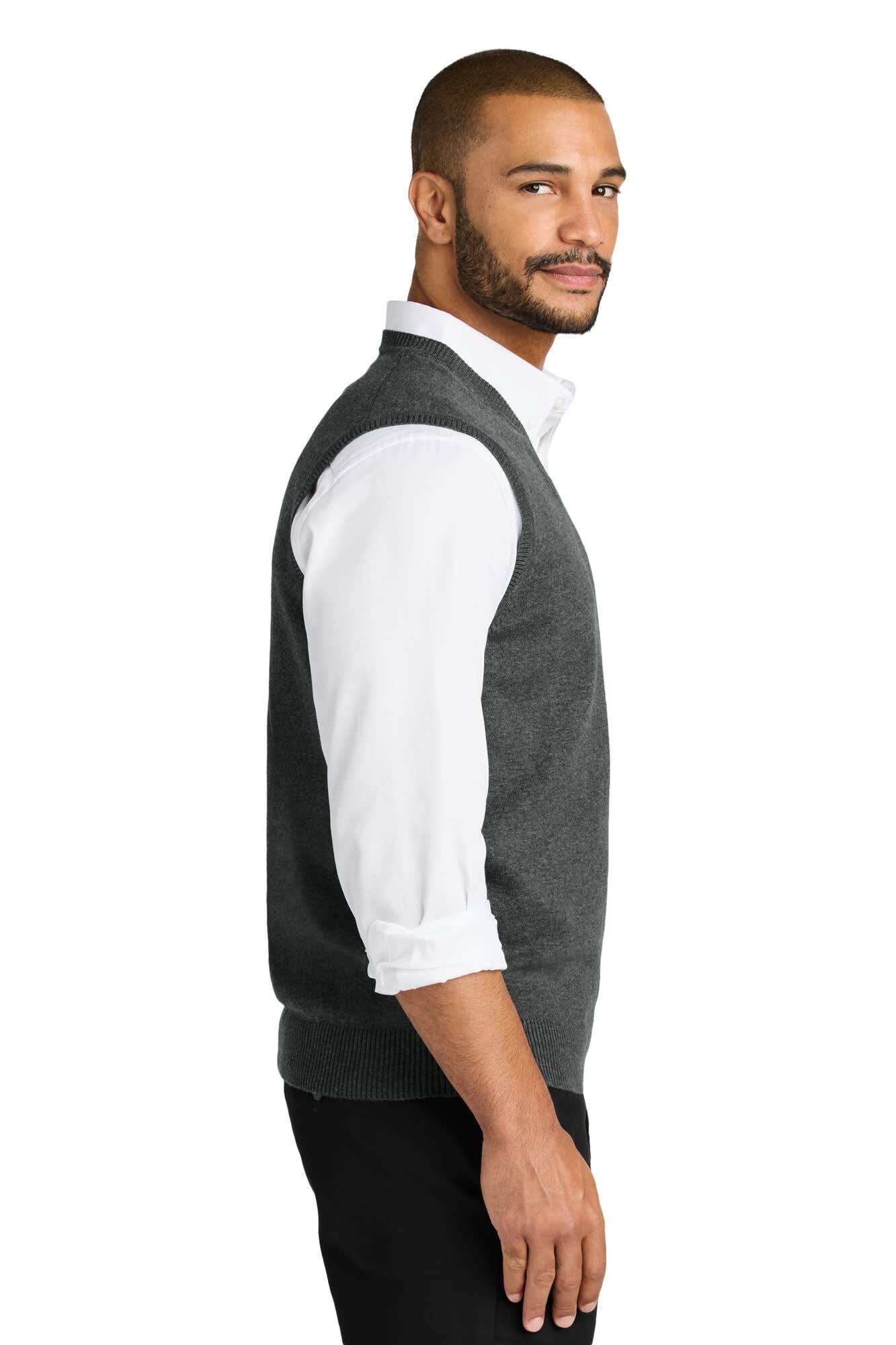 A grey sweater vest displayed on a model, featuring a side profile view, worn over a white shirt.