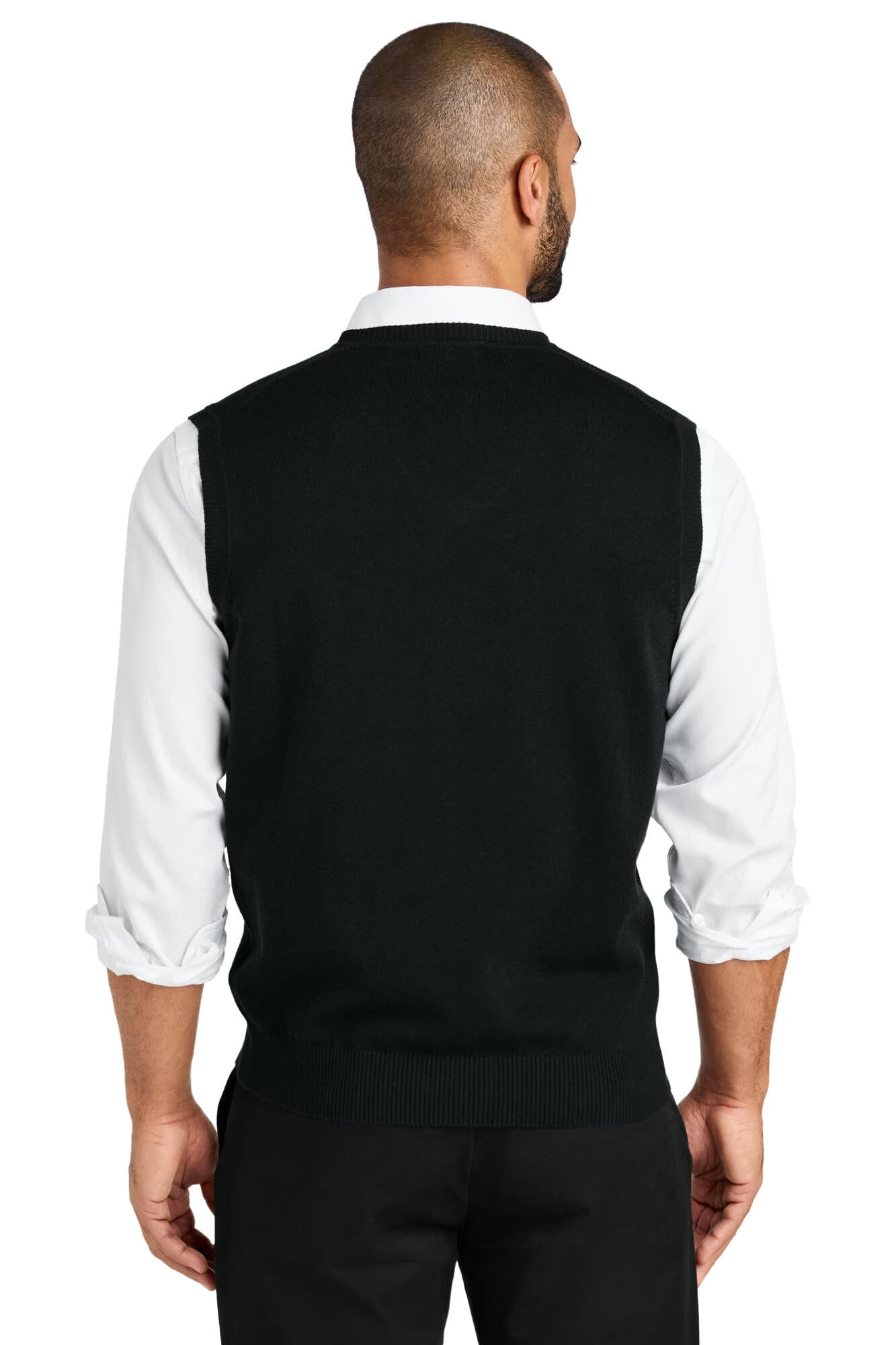 A black sweater vest from Port Authority, featuring a plain back and worn over a white shirt.
